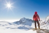 mountaineer-looking-at-a-snowy-mountain-landscape_original.jpg